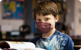  Boy looking at book