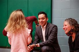  Dr. Bryantt smiling with students 
