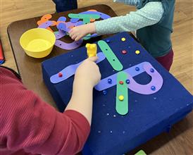 Playgroup children learning their letters Playgroup children learning their letters