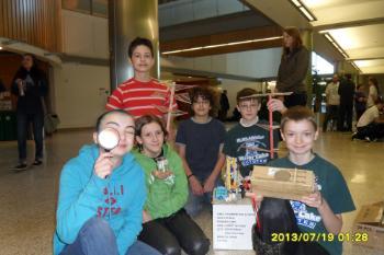 students holding science projects students holding science projects