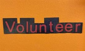  orange background with the works volunteer