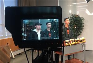 students record an episode of Orange Juice, West High's video news program 