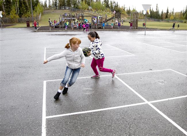 Two Trailside Elementary students play a game during recess. 