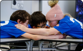  Book team conferring.