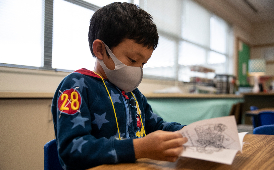  Boy reading at desk