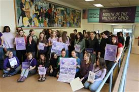 a group of students welcoming the month of the military child