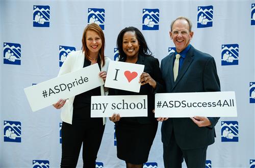 administrators holding ASD signs