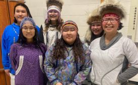  indigenous fashion show participants pose for a photo