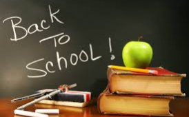  Blackboard with back to school written on it  with a stack of books and an apple