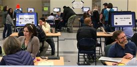Picture of teachers at ERHS conferencing with parents