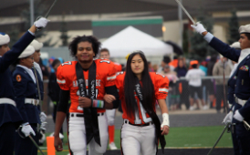  homecoming royalty on the football field