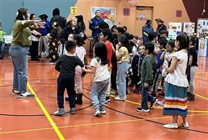 Mrs. Preuit Leads An Alaska Native Dance